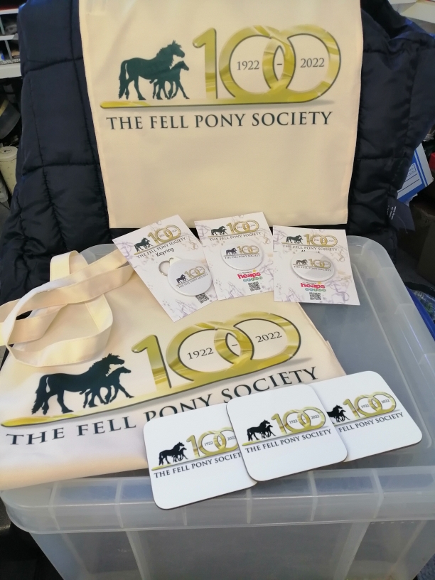 Coasters with FPS Centenary Logo White Coasters and cream coloured bags with FPS Centenary Logo