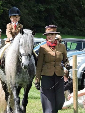 Grey fell pony with young rider Lewis Reynolds